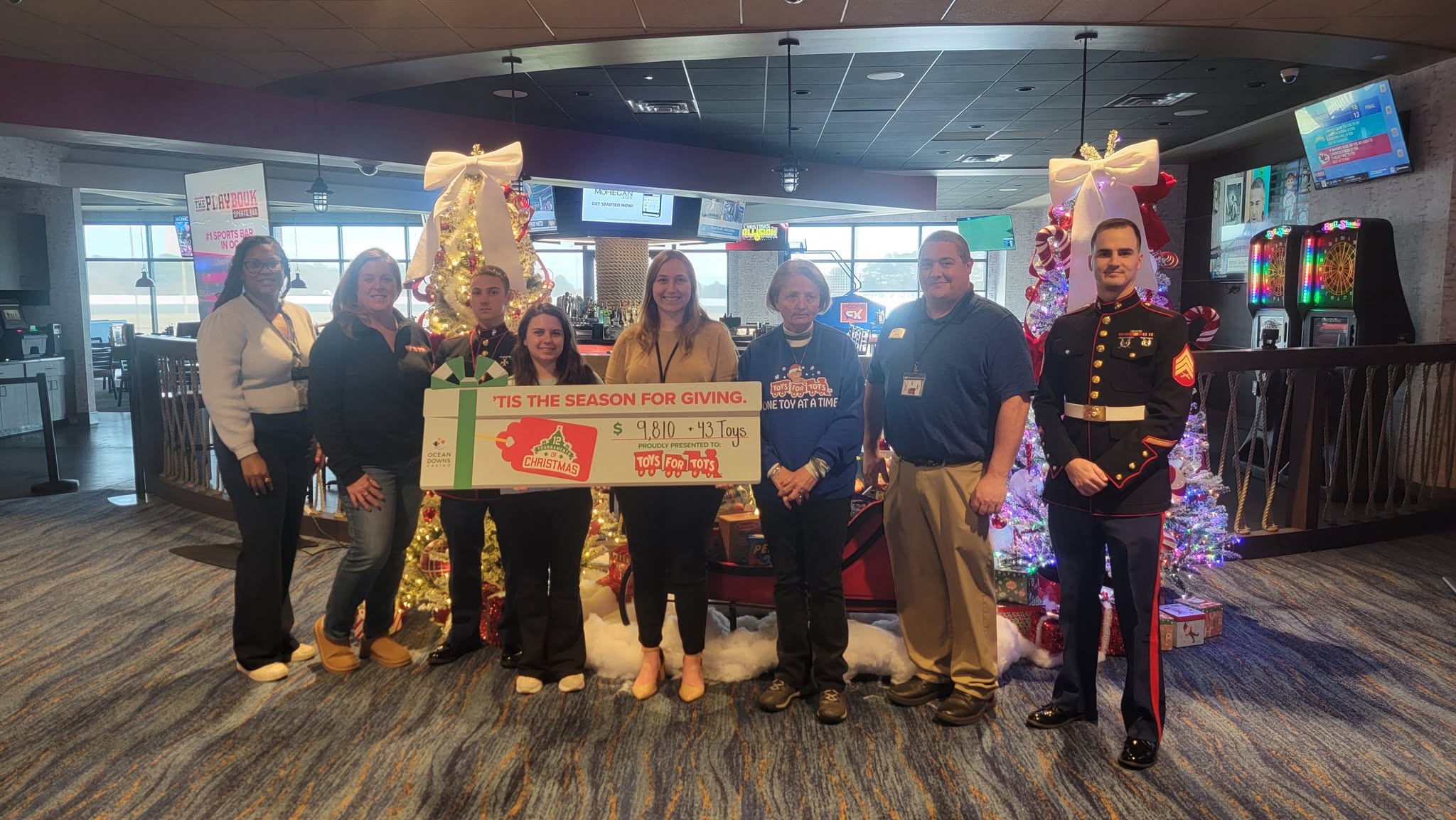 Check presentation to Toys for Tots for $9,810 + 43 toys
