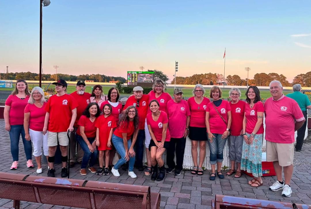 group of volunteers at the racetrack